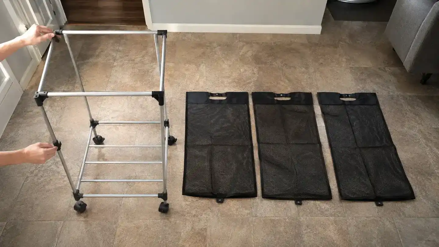 Simple Houseware laundry sorter with the three mesh bags pulled off the frame and laid flat beside it, showing bag dimensions